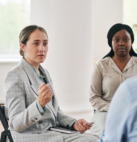 Women getting group addiction therapy in orange county with a female therapist.