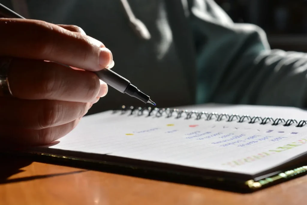 person journaling a recovery plan, symbolizing how to detox from Xanax safely with medical guidance and tapering strategies