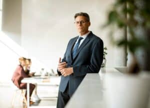 Executive business man considering whether or not he needs to go to rehab